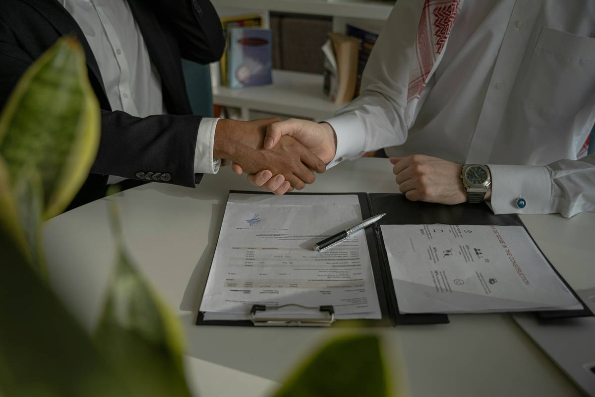 Negotiation Best Practices illustrated by a calm professional reviewing ransom demand letters with legal and insurance documents